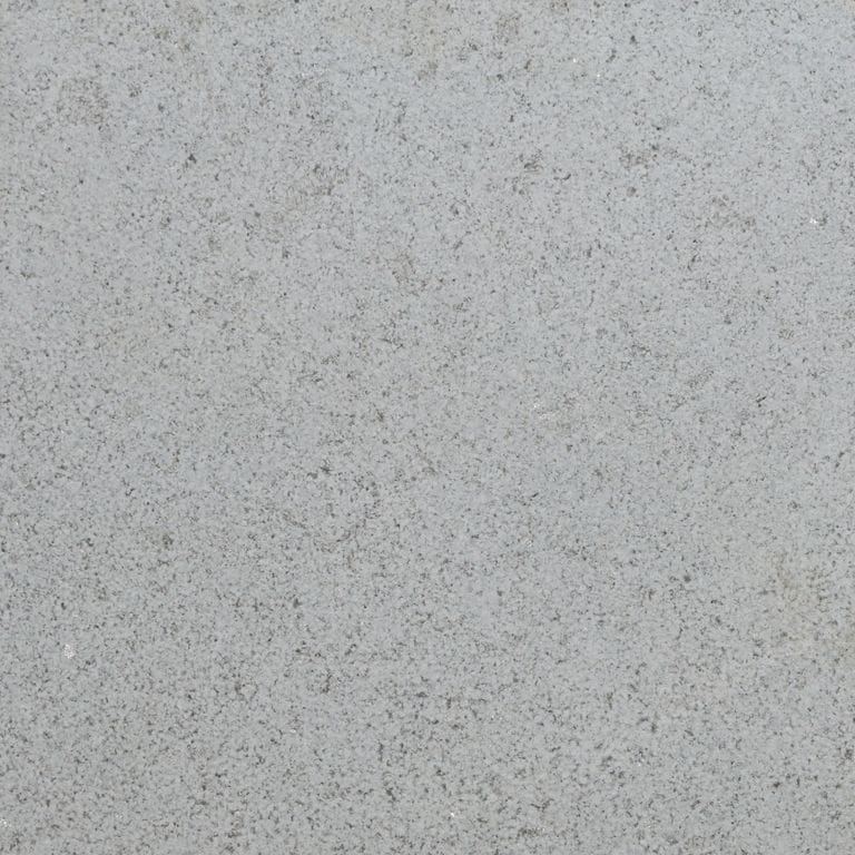 Color/Finish variation image for Northern Bay Limestone - Pavers. The surface finish shown is leathered. Dominant colors shown are gray and white. The color mix creates a cool feeling.