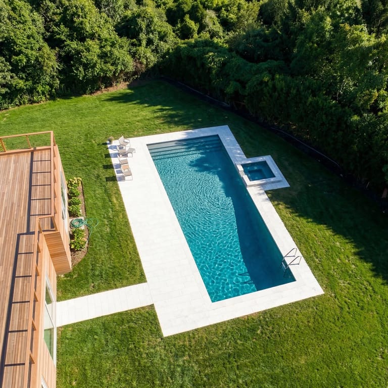 Application image for Moon Beige Limestone - Pool Deck. The image shows this product being used for pool coping, patio pavers and pool deck pavers. The surface finish shown is sand blasted. Dominant colors shown are beige and cream. The color mix creates a warm feeling.