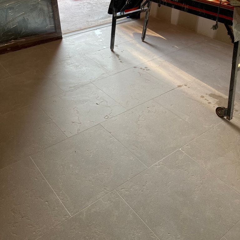 Best close-up image for Moon Beige Limestone - Interior Floor. The image shows this product being used in an interior floor application. The surface finish shown is . The dominant color shown is beige. The color mix creates a warm feeling.