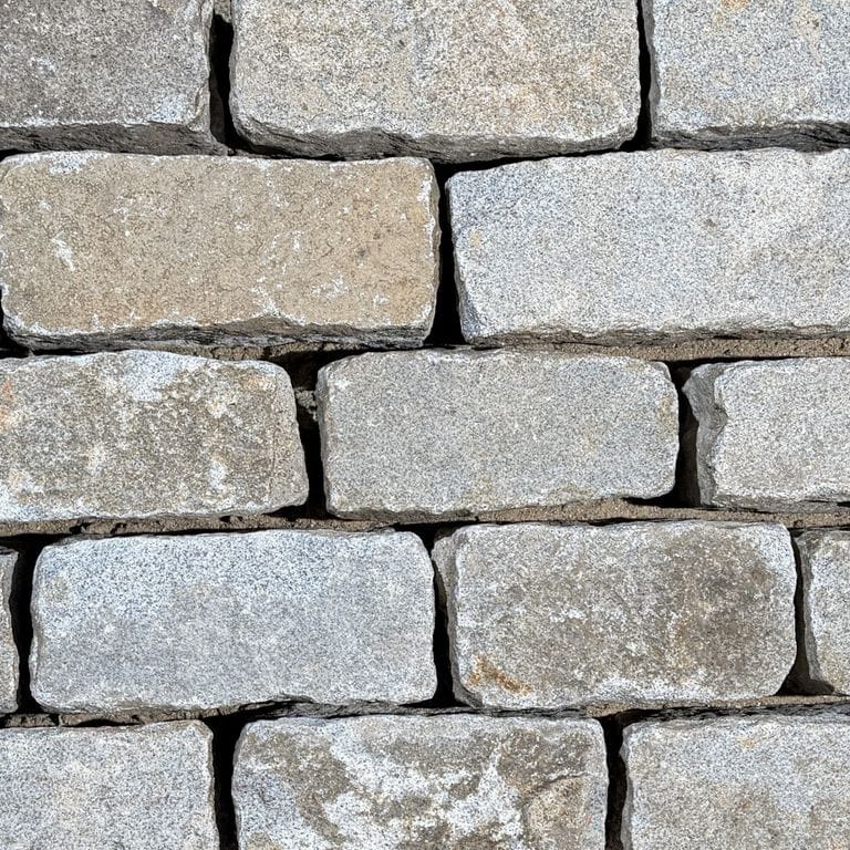 Color/Finish variation image for Reclaimed New England Regulation Cobblestones. The surface finish shown is . Dominant colors shown are gray and greige.