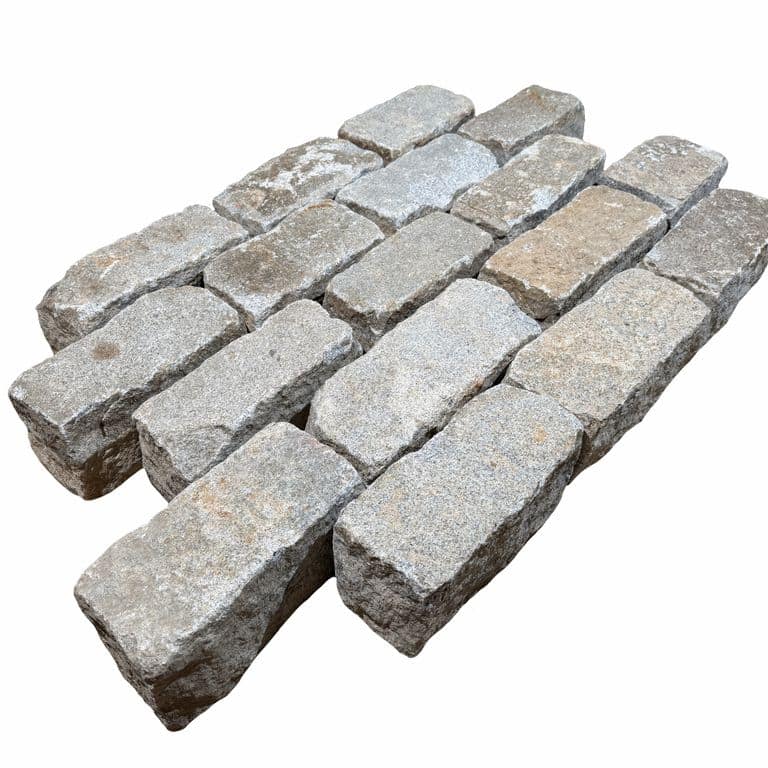 Feature image for Reclaimed New England Regulation Cobblestones. The surface finish shown is . The dominant color shown is gray. The color mix creates a warm feeling.