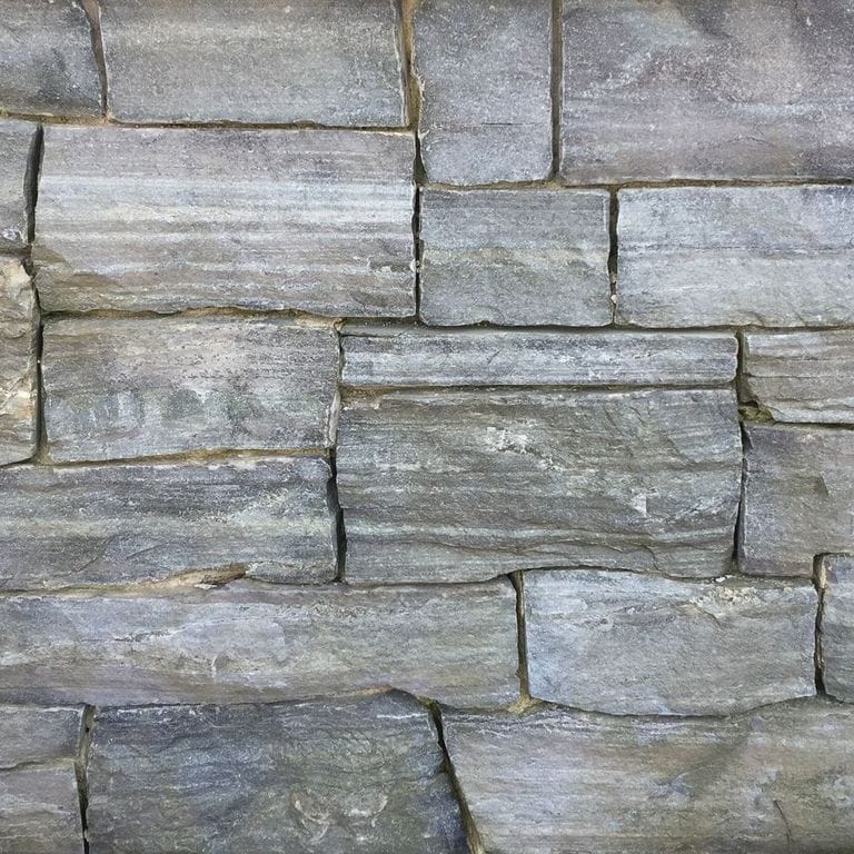 Application image for Mystic Mountian Granite - Veneer. The surface finish shown is split-face. The dominant color shown is gray. The color mix creates a cool feeling.