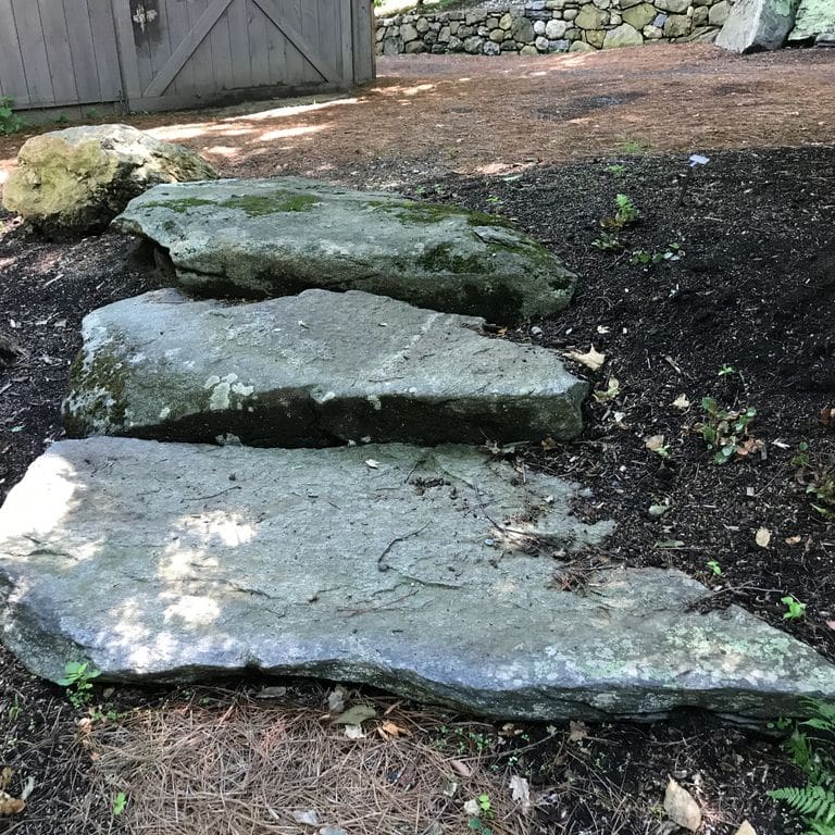 Application image for New England Fieldstone - Steps and Landings. The image shows this product being used in a monolithic steps application. This is a landscape stone for outdoor commercial and residential applications. Suitable for general use, freeze-thaw conditions, high traffic areas and low slipperiness surfaces situations. Moderate to higher on the price spectrum.