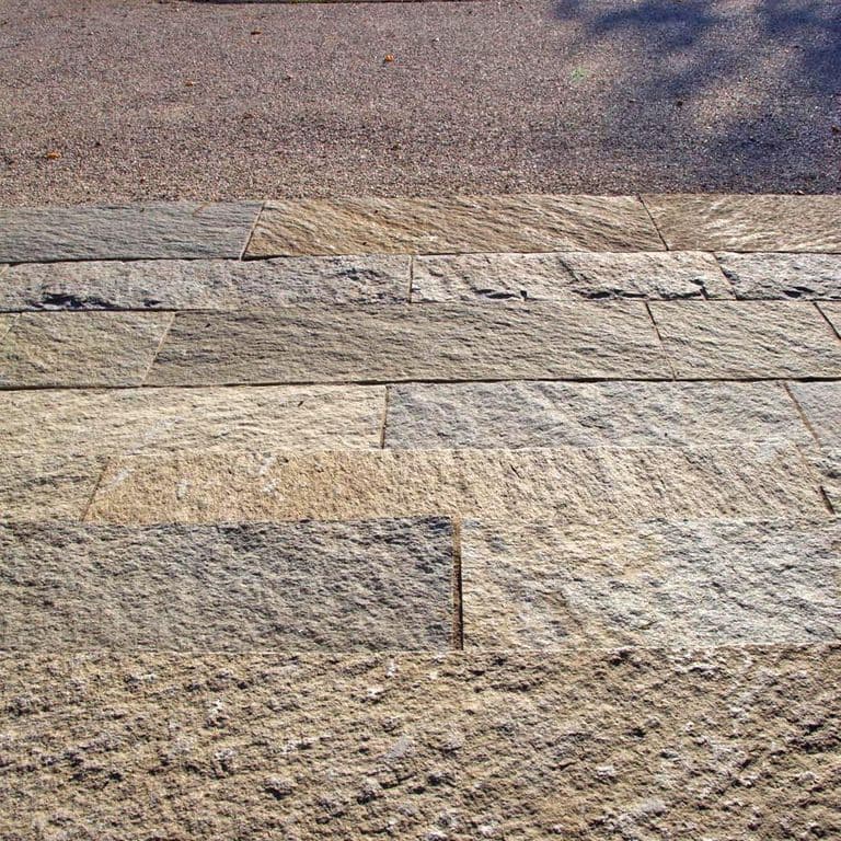 The image shows this product being used in a patio pavers application.