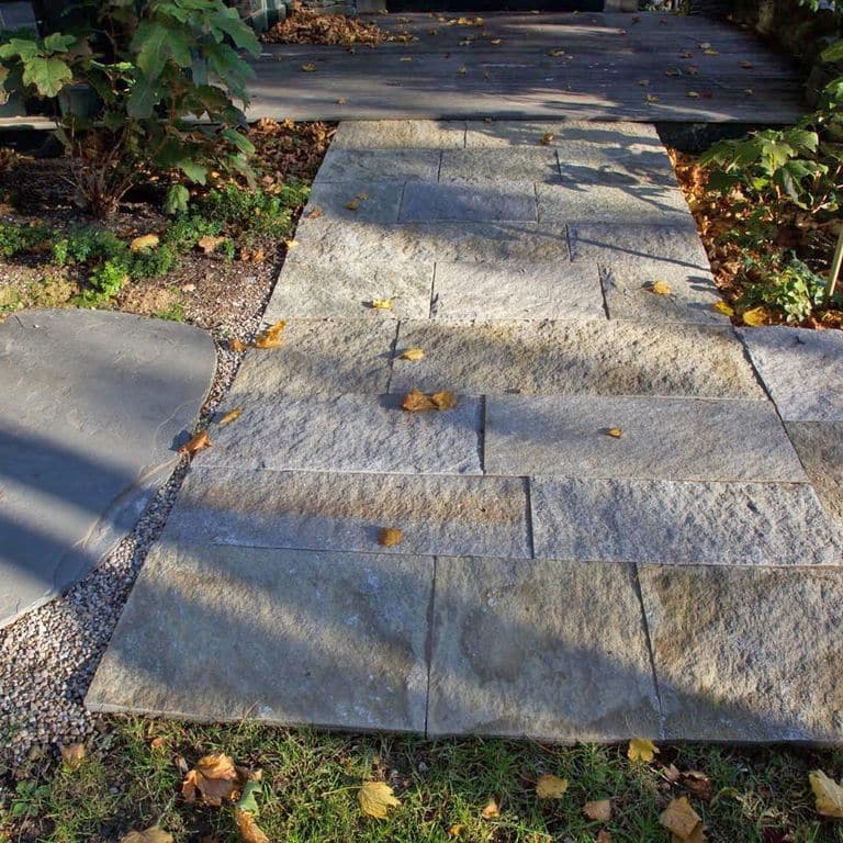 The image shows this product being used in a path pavers application.