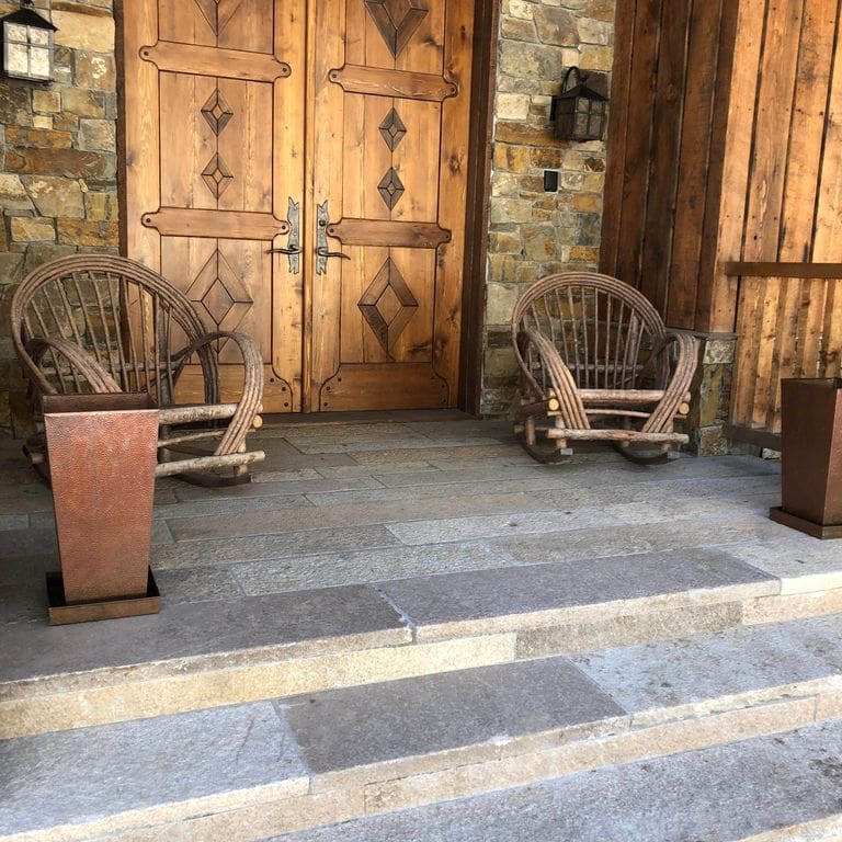 Application image for Reclaimed Footworn Granite - Plank Pavers. The image shows this product being used for landings and treads. The surface finish shown is . Dominant colors shown are gray and tan. The color mix creates a warm feeling.