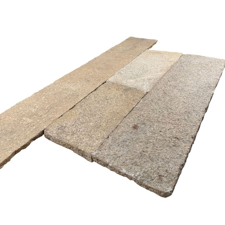 Color/Finish variation image for Reclaimed Footworn Granite - Plank Pavers. The surface finish shown is . Dominant colors shown are beige and tan. The color mix creates a warm feeling.