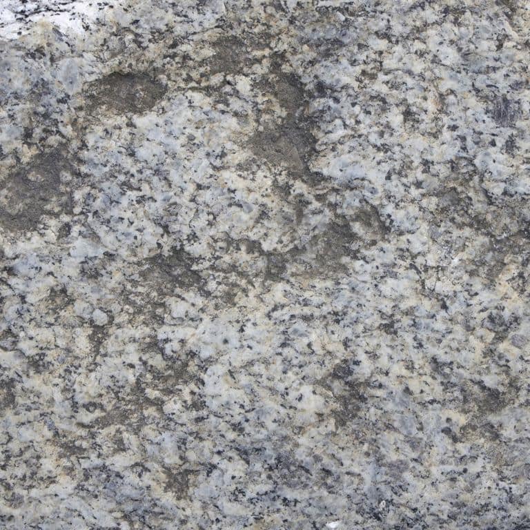 Color/Finish variation image for Reclaimed First Generation Granite Curbstone Steps - Textured Riser and Tread. The dominant color shown is gray; with beige, blue, brown, green, purple and white secondaries. The color mix creates a cool feeling. Speckled, blotched, swirled and cloudy color patterns. Contains mineral inclusions.