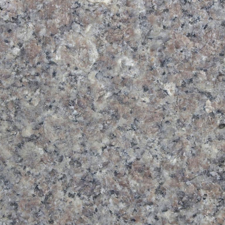 Color/Finish variation image for Reclaimed First Generation Granite Curbstone Steps - Textured Riser and Tread. The dominant color shown is gray; with blue, green, purple and white secondaries. The color mix creates a cool feeling. Coarse speckled color pattern. Contains mineral inclusions.