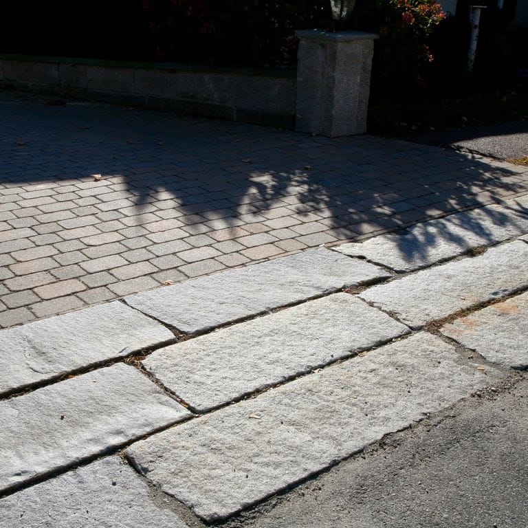 The image shows this product being used in a driveway aprons application.