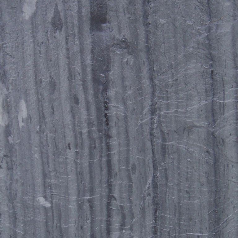 Swatch image cropped for Vermont Slate Striated Gray - Roof Shingles. The surface finish shown is natural cleft. Dominant colors shown are blue and gray; with green and purple secondaries. Exhibits "movement" and the color mix creates a cool feeling. Blotched, linear, streaked and cloudy color patterns.