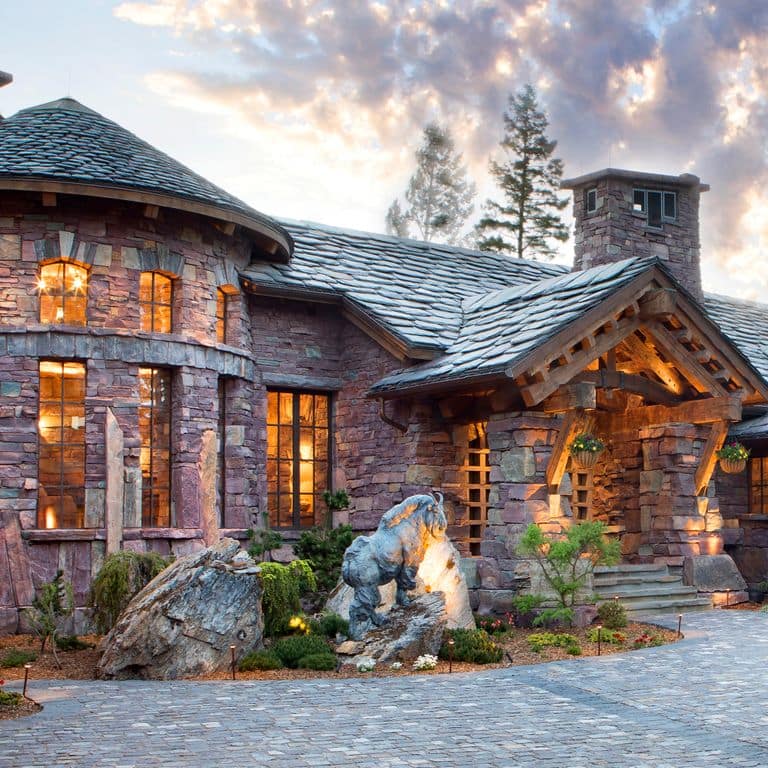 Feature image for Vermont Slate Striated Gray - Roof Shingles. The image shows this product being used in a Roof Shingles application. The dominant color shown is gray; with blue and white secondaries. Exhibits "movement" and the color mix creates a cool feeling. Regular, linear and streaked color patterns.