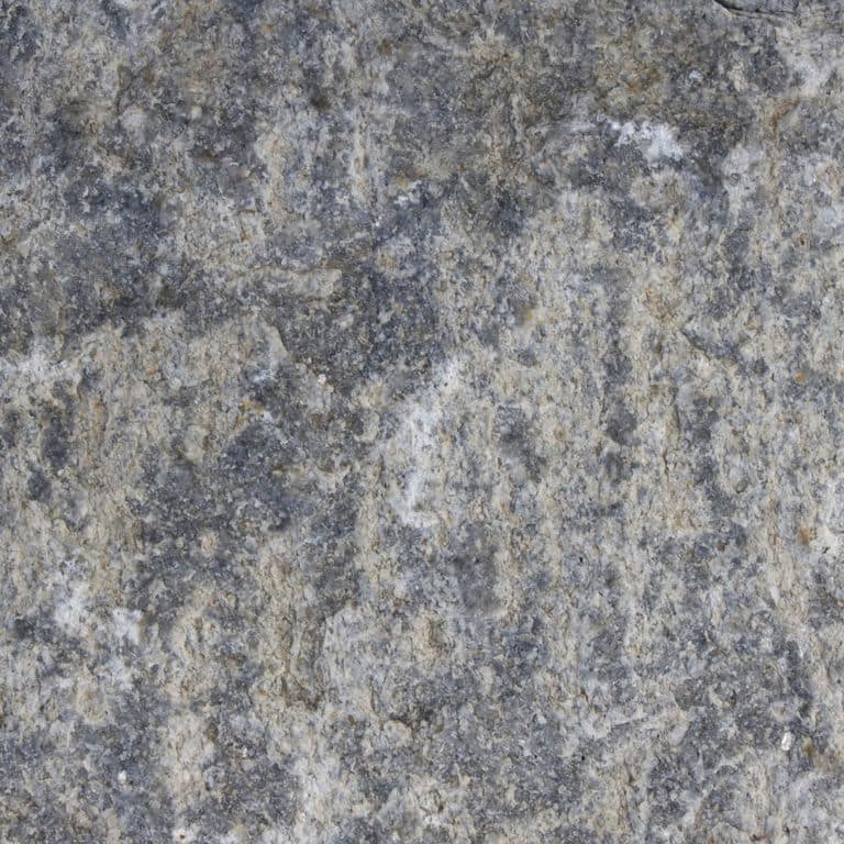 Color/Finish variation image for Reclaimed Granite Curbstone - Pool Coping. The dominant color shown is gray; with blue, brown, green, purple, white and tan secondaries. The color mix creates a cool feeling. Random, speckled, blotched, swirled and cloudy color patterns.