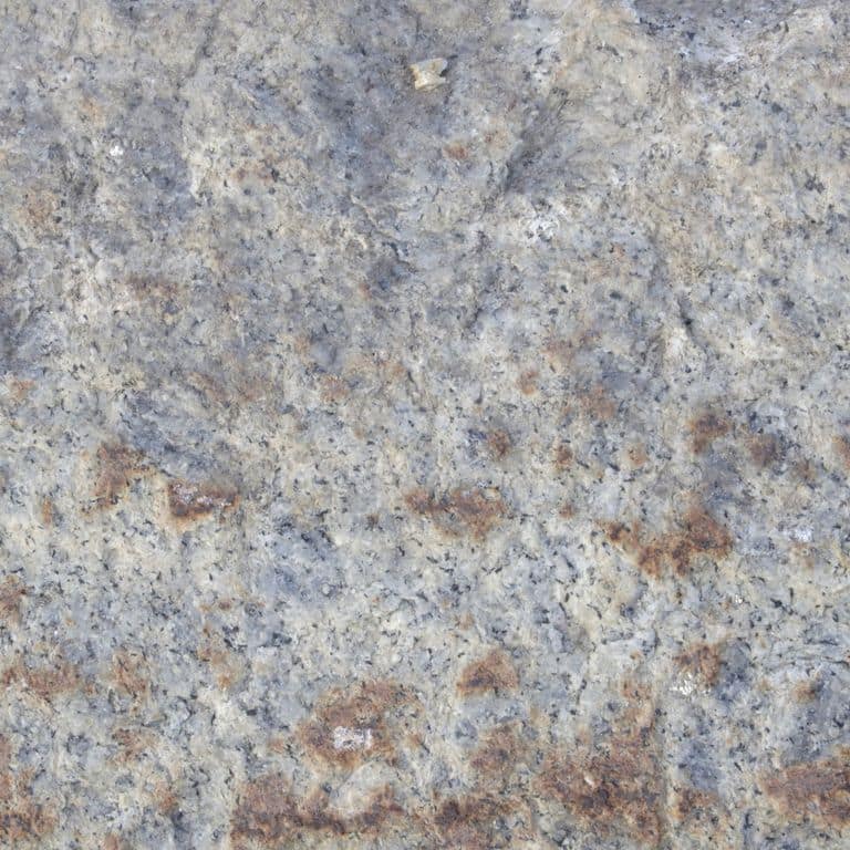 Color/Finish variation image for Reclaimed Granite Curbstone - Pool Coping. The dominant color shown is gray; with beige, blue, orange/rust, purple and white secondaries. Exhibits "movement" and the color mix creates a cool feeling. Random, speckled, blotched and swirled color patterns. Contains some mica and mineral inclusions.