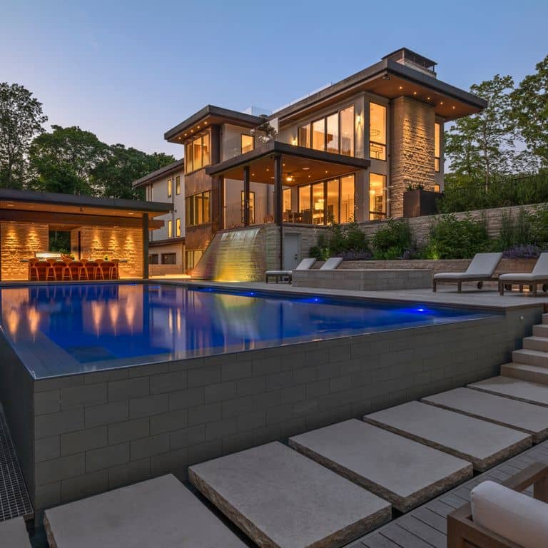 Application image for Mountain Hard Beige Limestone - Pavers. The image shows this product being used for patio pavers, monolithic steps, full bed veneer and pool deck pavers. Dominant colors shown are beige, tan and cream.