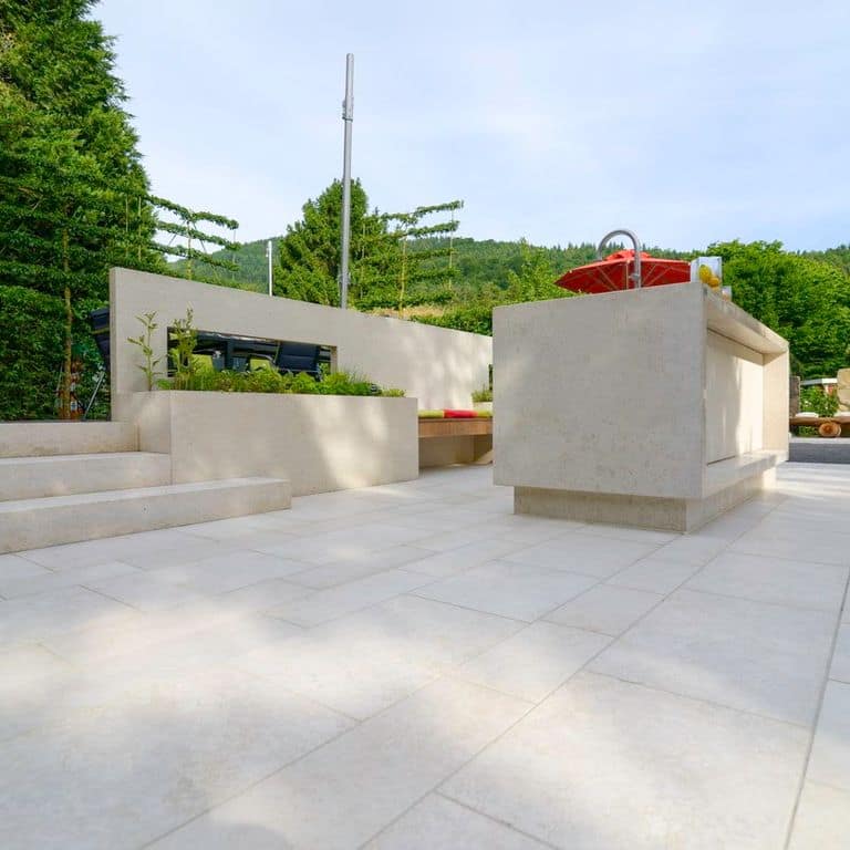 The image shows this product being used in a patio pavers application.