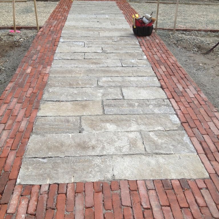 The image shows this product being used in a path pavers application.