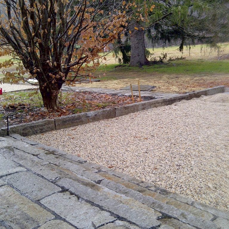 The image shows this product being used in a driveway pavers application.
