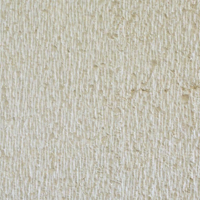 Swatch image cropped for Mountain Hard Limestone Beige - Wall Veneer. The surface finish shown is chiseled. Dominant colors shown are beige, gray and white; with brown, tan and cream secondaries. The color mix creates a warm feeling. Regular and linear color patterns.