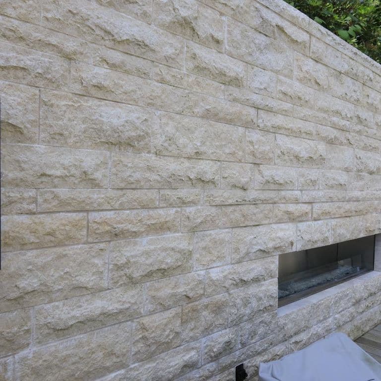 Application image for Mountain Hard Beige Limestone - Cut to Size Veneer. The image shows this product being used in a full bed veneer application. The surface finish shown is split-face. Dominant colors shown are beige and cream. The color mix creates a warm feeling.