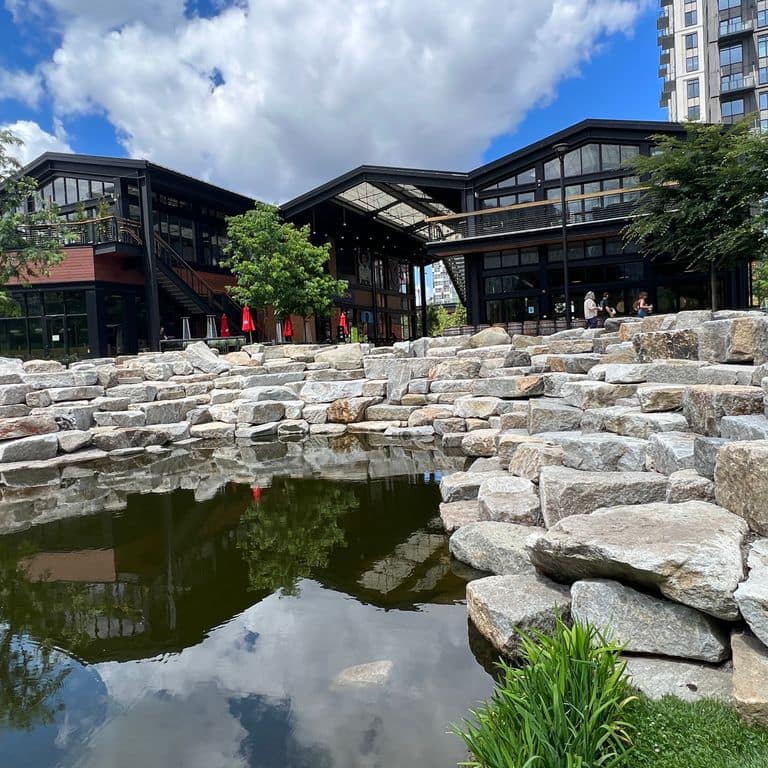 Application image for Granite - Reclaimed Block - Benches. The image shows this product being used in a seating &amp; benches application. The dominant color shown is gray. The color mix creates a warm feeling.