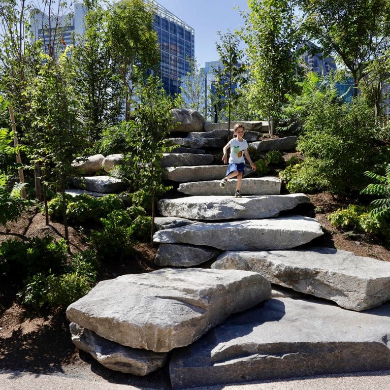 Application image for Reclaimed New England Granite Quarry Tailings - Steps and Landings. The image shows this product being used for landings and monolithic steps. This is a landscape stone for outdoor commercial and residential applications. Suitable for general use, freeze-thaw conditions, low heat absorption surfaces, high traffic areas, low slipperiness surfaces and high heel compatibilty situations. Higher to high on the price spectrum.
