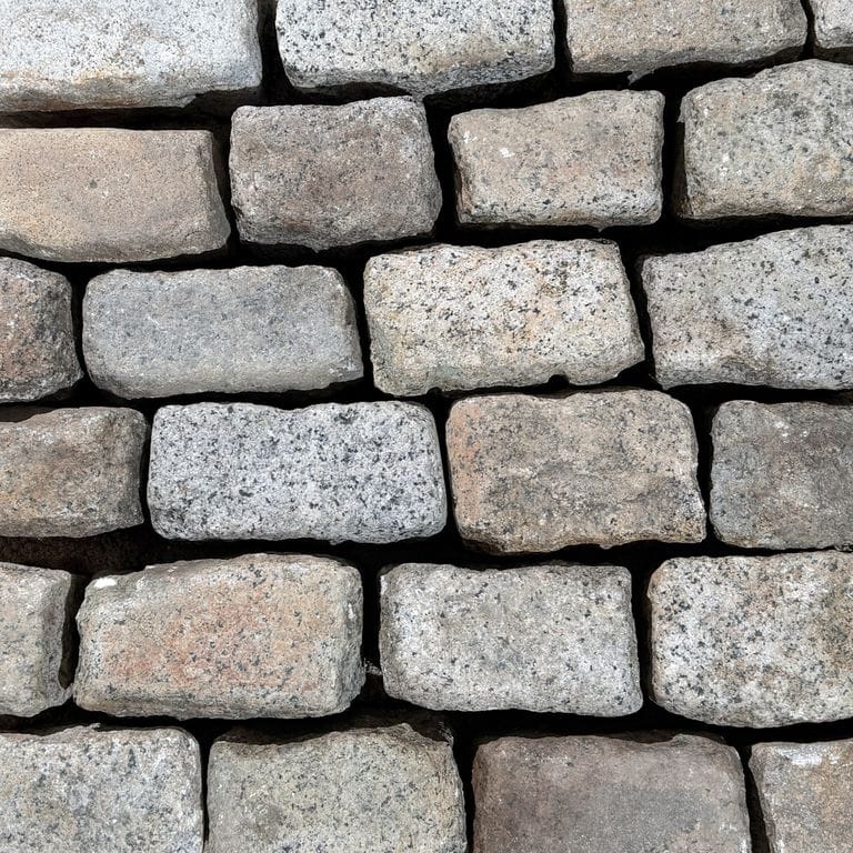 Color/Finish variation image for Reclaimed New England Cobblestones - Medium Worn Top. The surface finish shown is . Dominant colors shown are gray and greige. The color mix creates a warm feeling.