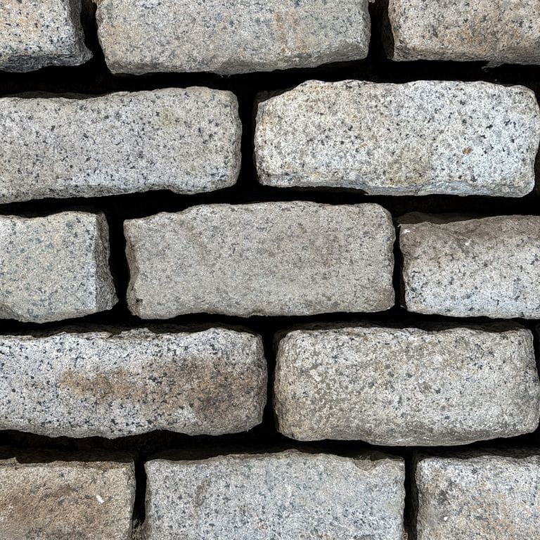 Color/Finish variation image for Reclaimed New England Cobblestones - Jumbo Worn Top. The surface finish shown is . Dominant colors shown are gray and greige. The color mix creates a warm feeling.