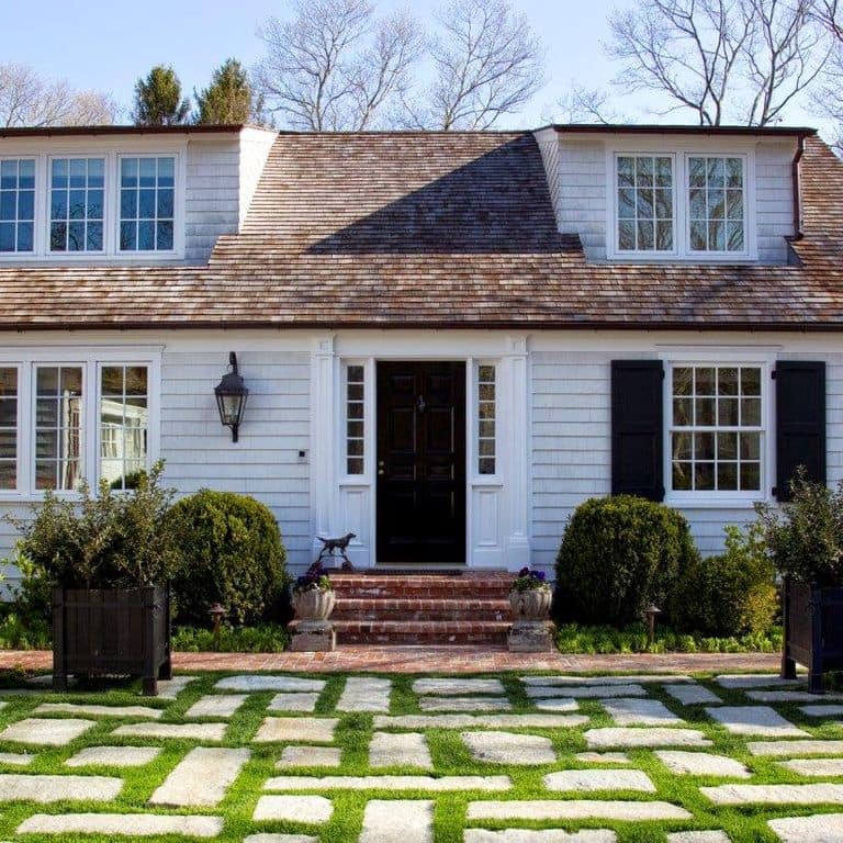 Application image for Reclaimed New England Granite Cobblestones - Super Jumbo Pavers. The image shows this product being used in a patio pavers application. The surface finish shown is . Dominant colors shown are beige and gray. The color mix creates a warm feeling.