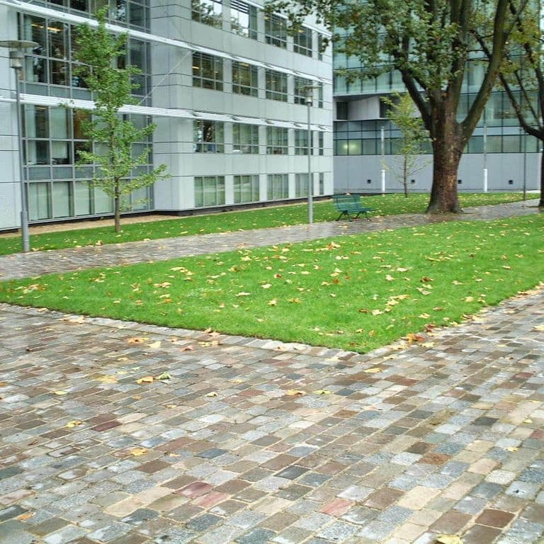 The image shows this product being used in a path pavers application.
