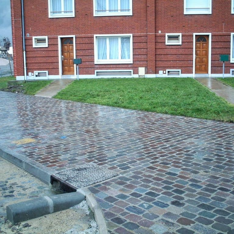 The image shows this product being used in a path pavers application.