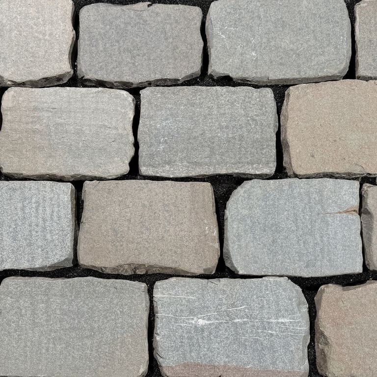 Color/Finish variation image for Reclaimed European Sandstone Cobblestones - Rectangle - Flat Surface. The surface finish shown is flamed. The dominant color shown is gray.