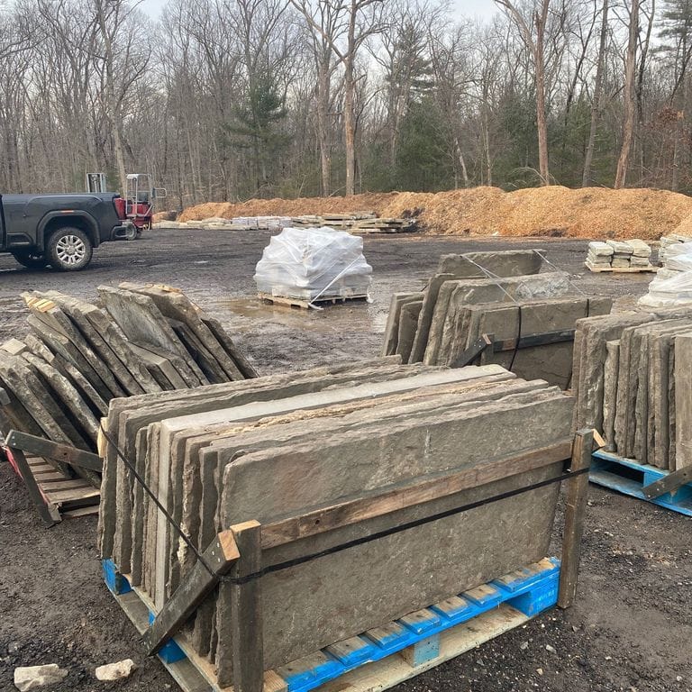 Application image for Reclaimed Bluestone Sidewalk Stones. The surface finish shown is natural cleft. The dominant color shown is gray.