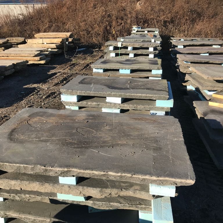 Application image for Reclaimed Bluestone Sidewalk Stones. The surface finish shown is natural cleft. The dominant color shown is gray. The color mix creates a warm feeling.