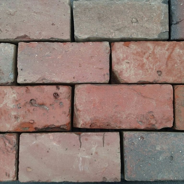Application image for Brick- Reclaimed Boston Pavers. The surface finish shown is . Dominant colors shown are brown, gray, pink and red. The color mix creates a warm feeling. Regular color pattern.