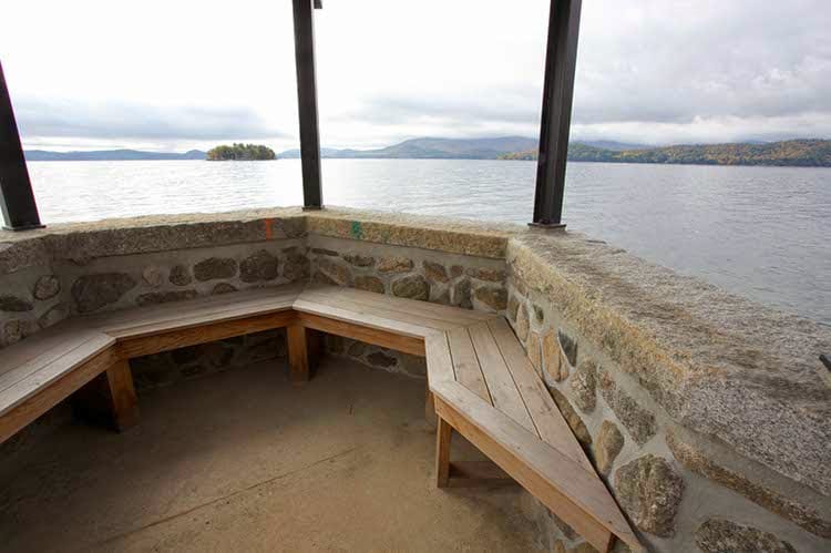 Application image for Reclaimed Granite Capstones. The image shows this product being used in a wallstone cap application. This is a landscape stone for outdoor commercial and residential applications. Suitable for general use, freeze-thaw conditions and low heat absorption surfaces situations. Moderate to higher on the price spectrum.