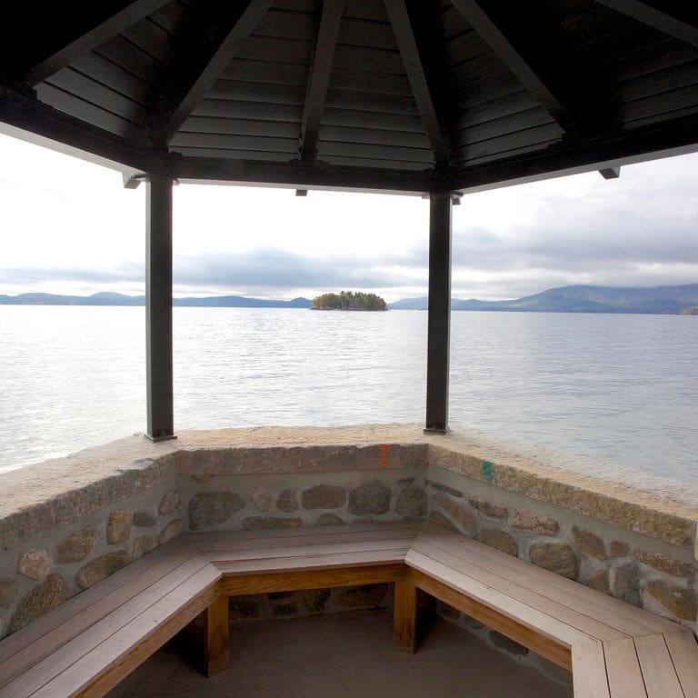 Application image for Reclaimed Granite Capstones. The image shows this product being used in a wallstone cap application. This is a landscape stone for outdoor commercial and residential applications. Suitable for general use, freeze-thaw conditions and low heat absorption surfaces situations. Moderate to higher on the price spectrum.