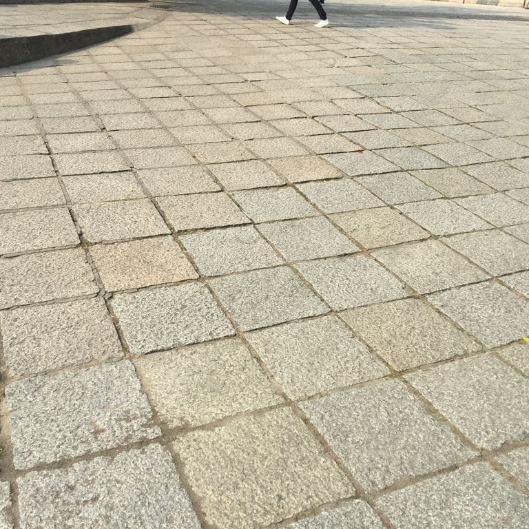 Application image for Reclaimed Granite Pavers - Squares. The surface finish shown is . Dominant colors shown are beige and tan. Regular and speckled color patterns.