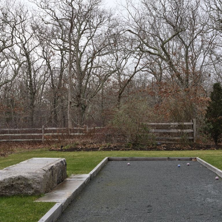 Application image for Reclaimed Granite Bridge Blocks - Benches and Seating. The image shows this product being used in a seating &amp; benches application. The surface finish shown is . Dominant colors shown are brown and gray. The color mix creates a warm feeling. Regular and speckled color patterns.