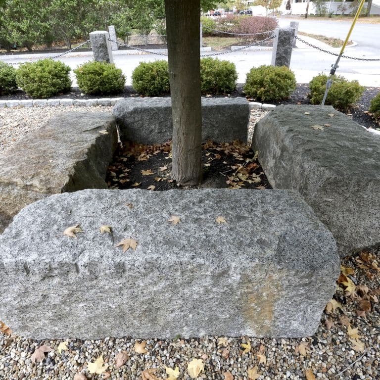 Application image for Reclaimed Granite Bridge Blocks - Benches and Seating. The image shows this product being used in a seating &amp; benches application. This is a landscape stone for outdoor commercial and residential applications. Suitable for general use, freeze-thaw conditions, low heat absorption surfaces and low slipperiness surfaces situations. Relatively higher in price.