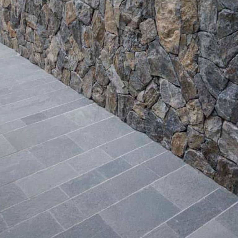 Application image for Quartzite - Greek Slate - Grey - Dimensional Sawn Pavers. The image shows this product being used in a path pavers application. The dominant color shown is gray.