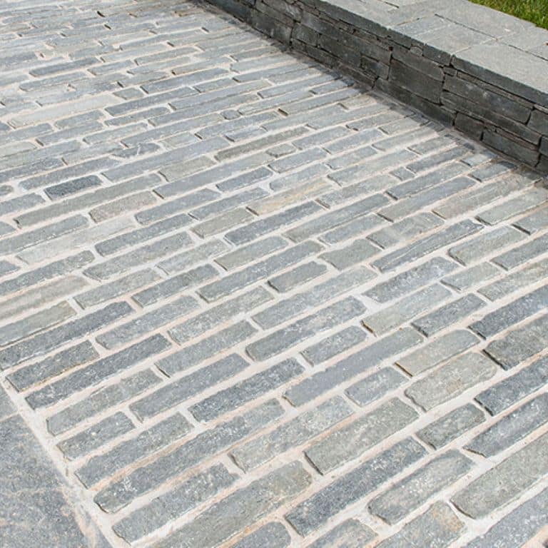 The image shows this product being used in a path pavers application.
