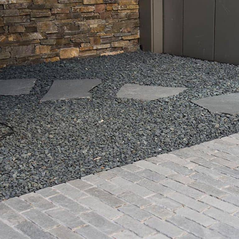 The image shows this product being used in a driveway pavers application.