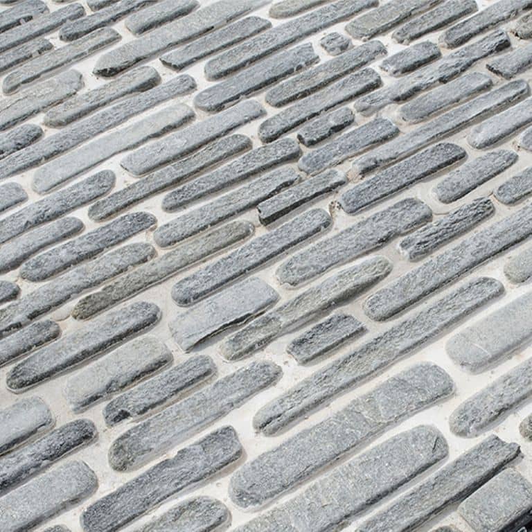 The image shows this product being used in a path pavers application.