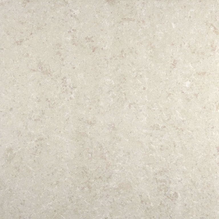 Best close-up image for Classimo Beige Limestone Pavers. The surface finish shown is flamed. Dominant colors shown are beige and cream; with gray and tan secondaries. The color mix creates a warm feeling. Regular and blotched color patterns. Contains mineral inclusions.