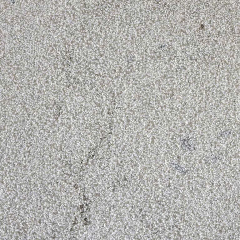 Color/Finish variation image for Sky Prima Limestone - Veneer. The surface finish shown is bush hammered. The dominant color shown is gray; with beige and white secondaries. The color mix creates a cool feeling. Speckled and cloudy color patterns.