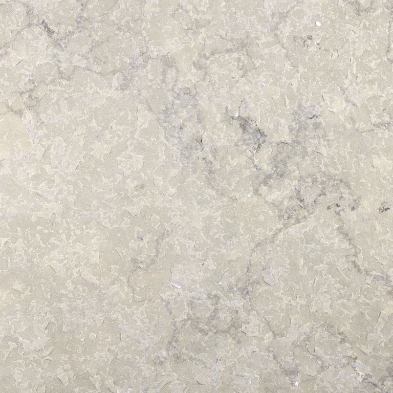 Color/Finish variation image for Sky Prima Limestone - Veneer. The surface finish shown is flamed. Dominant colors shown are beige, gray and cream; with white and tan secondaries. Exhibits "movement". Blotched and cloudy color patterns.