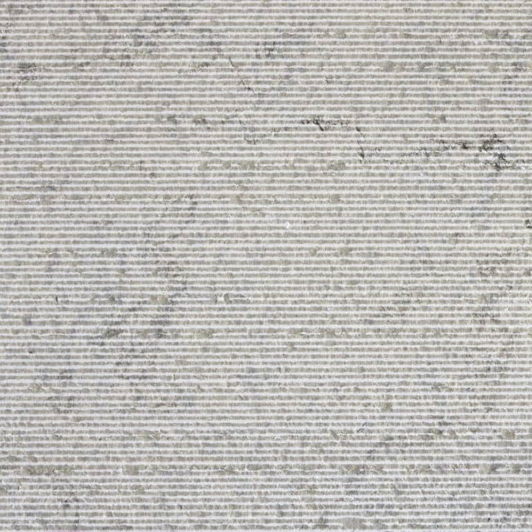 Color/Finish variation image for Sky Prima Limestone - Veneer. The surface finish shown is grooved. Dominant colors shown are gray and white; with a beige secondary. The color mix creates a cool feeling. Speckled, linear and cloudy color patterns.