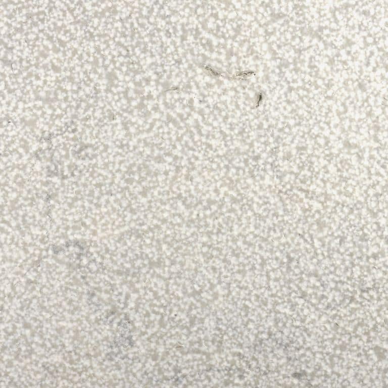 Color/Finish variation image for Sky Prima Limestone Cobblestones. The surface finishes shown are brushed and bush hammered. Dominant colors shown are beige, gray, white and cream. Speckled, coarse speckled and cloudy color patterns.