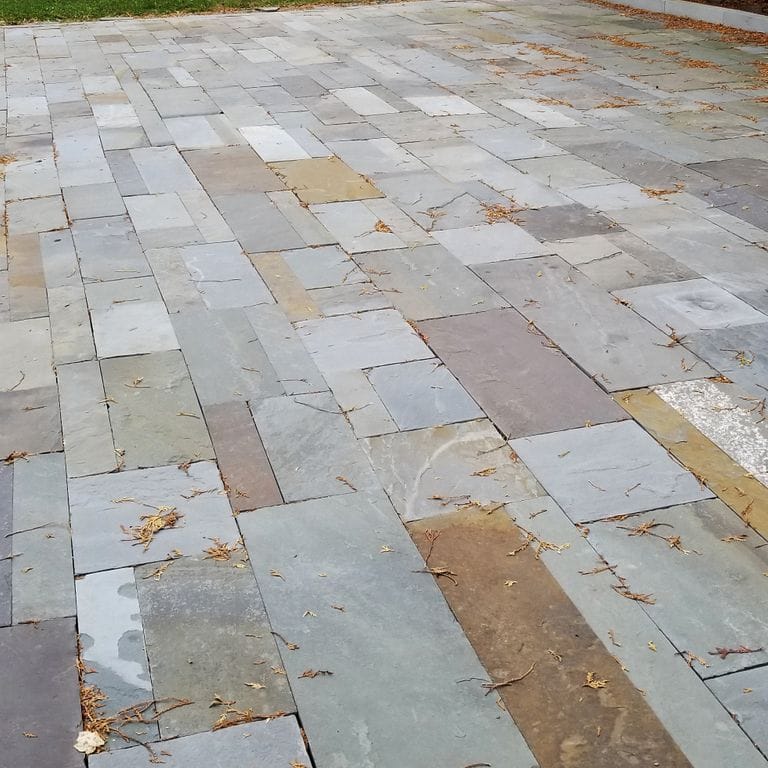The image shows this product being used in a patio pavers application.